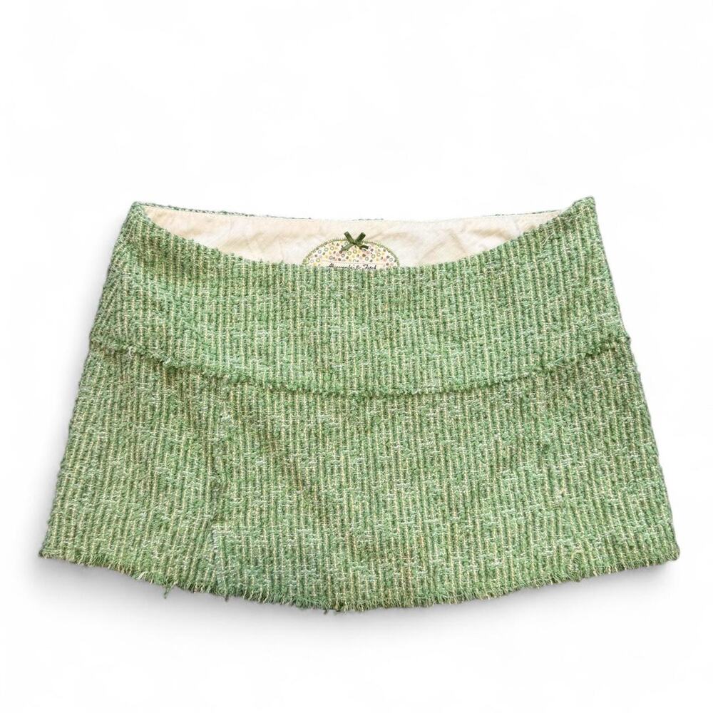 Green tweed mini skirt with